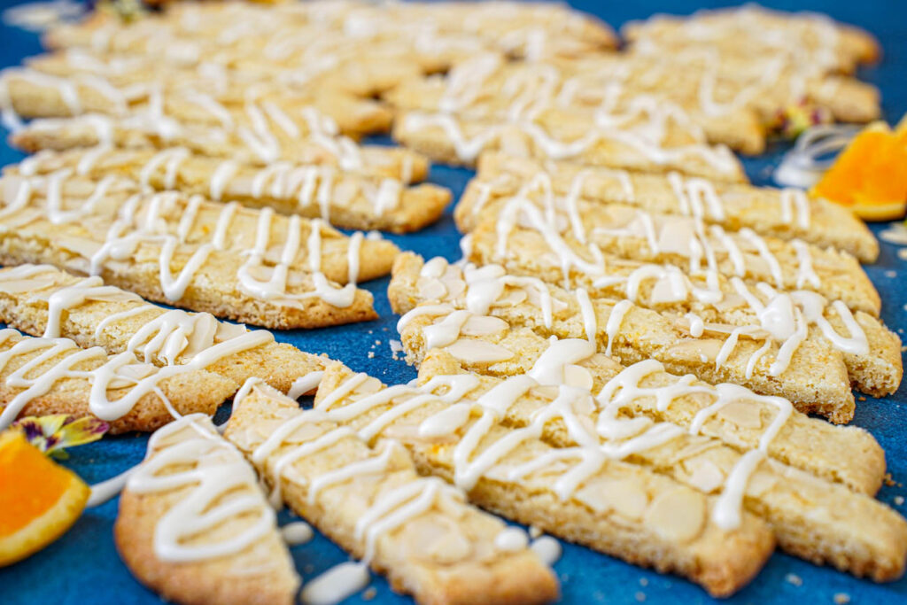 Side view of Orange Almond Cookie Bars drizzled with icing.