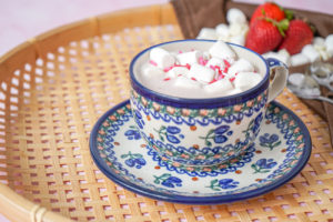 Strawberry White Hot Chocolate in a blue ceramic teacup.