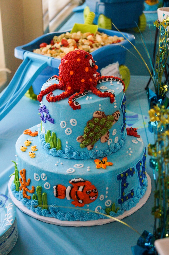 Side view of Ocean birthday cake with clown fish, turtle, and red octopus.
