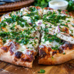 Roasted Garlic Chicken Pizza cut into slices.