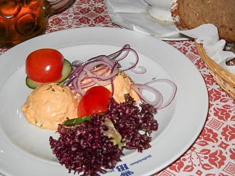 Obatzda from the Hofbräuhaus in Munich, Germany- on a white plate.