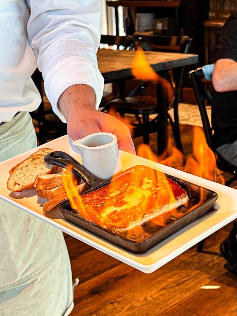 Saganaki (Greek Fried Cheese) on fire at Wine Bar George.