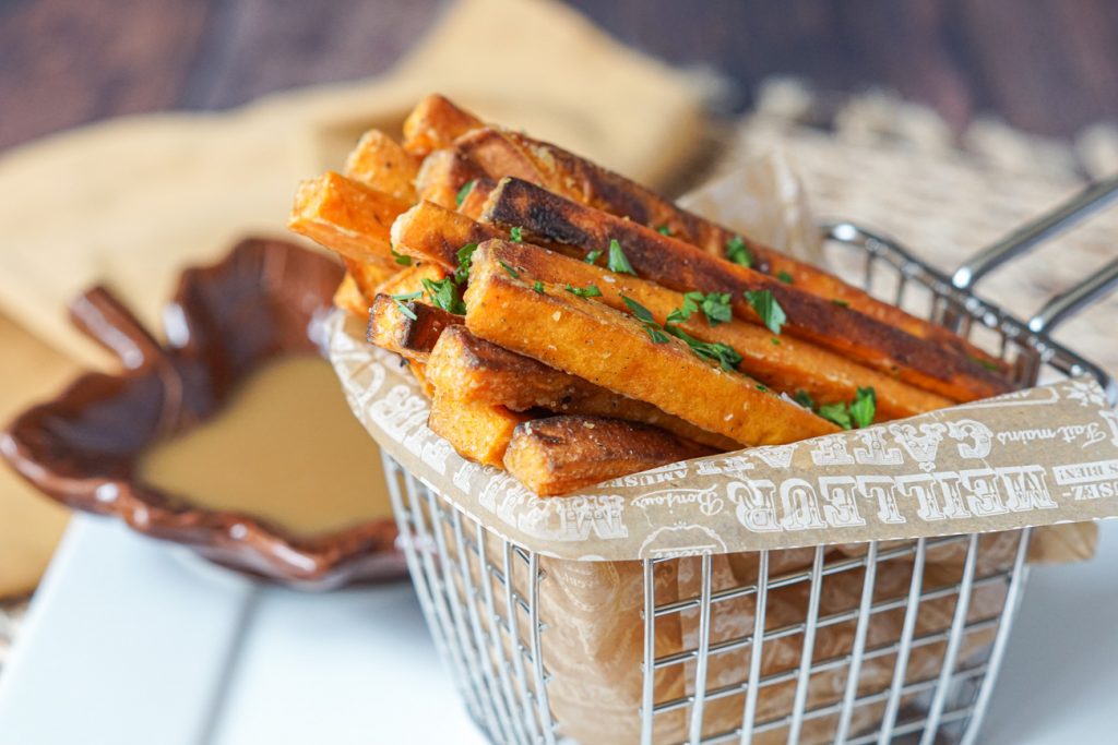 Spiced Sweet Potato Fries with Maple Mustard Dipping Sauce Spiced Sweet Potato Fries with Maple Mustard Dipping Sauce in a basket.
