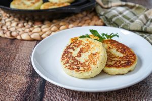 Three Irish Potato Cakes on a white plate.