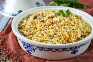 Sun-Dried Tomato Couscous in a large white and blue tagine.