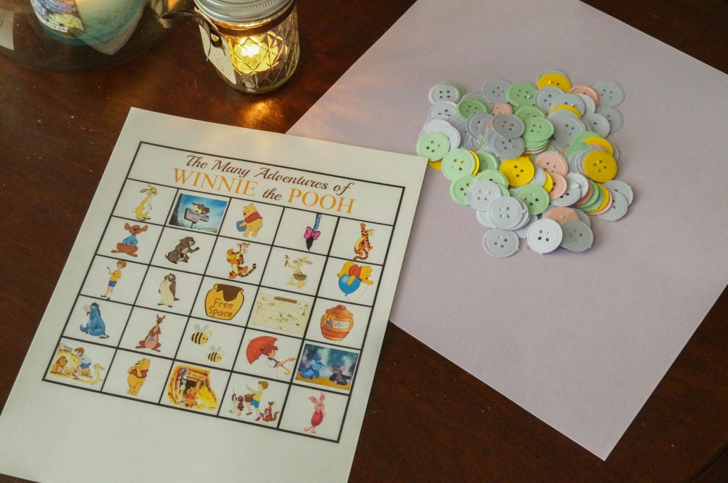 Winnie the Pooh Bingo card with buttons punched out in pastel colors.