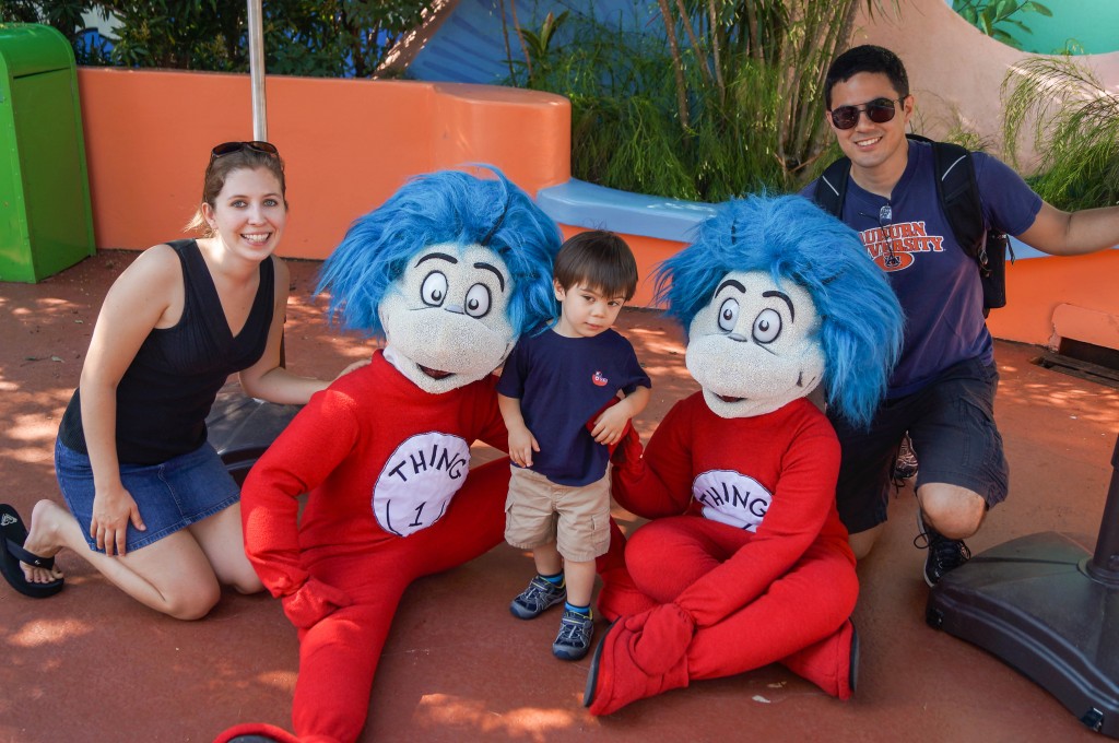 Mom, Dad, and son taking a photo with Thing 1 and Thing 2.