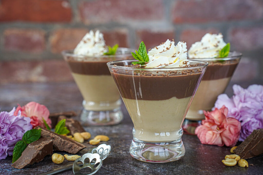 Side view of Chocolate and Peanut Butter Pudding in three glasses.