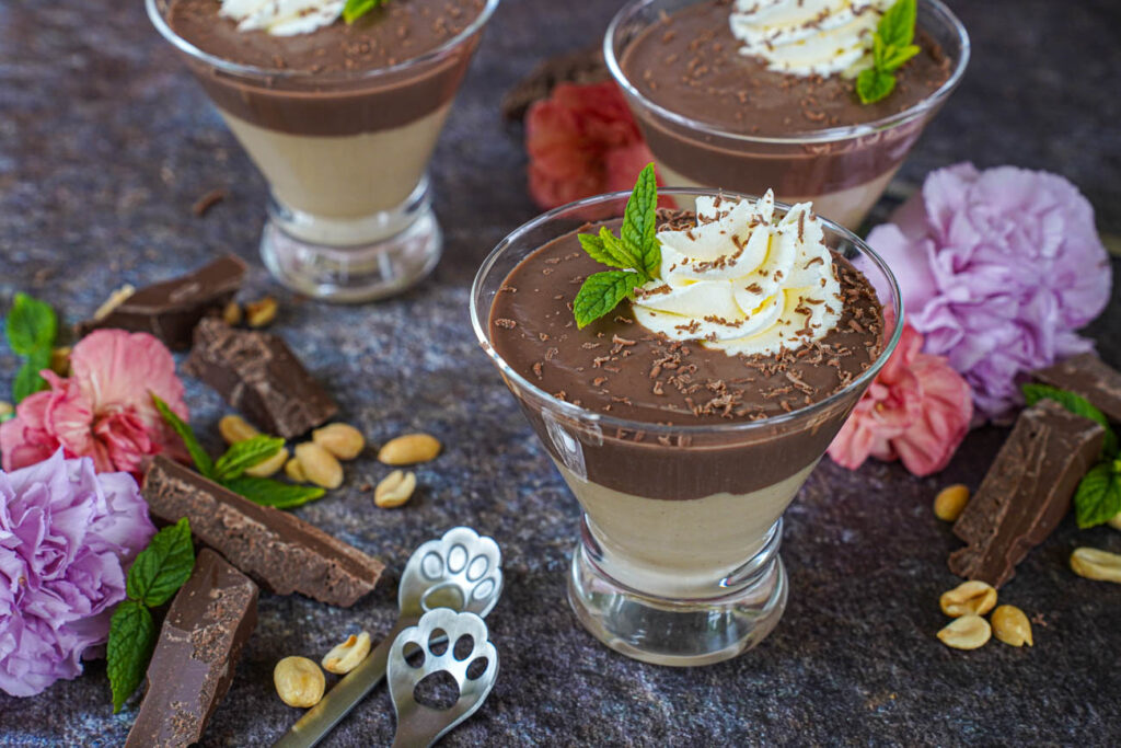 Chocolate and Peanut Butter Pudding in three glasses.