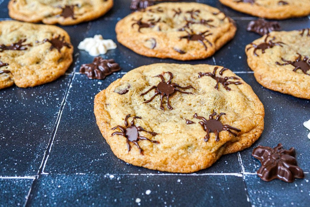 Spider Chocolate Chip Cookies next to chocolate spiders.