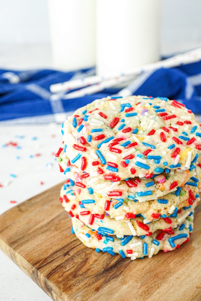 A stack of five Sprinkle Sugar Cookies with red, white, and blue sprinkles.
