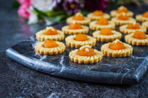 Kuih Tart (Pineapple Tarts) on a marble board.