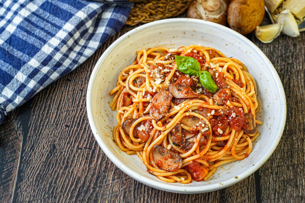 Mushroom Tomato Sauce with spaghetti in a bowl.