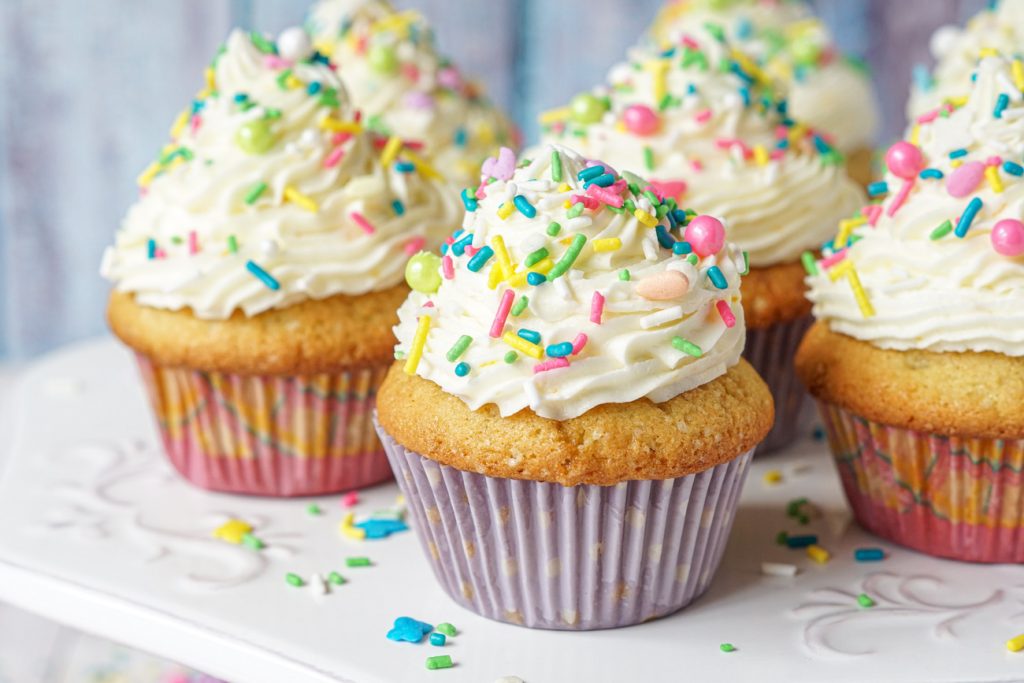Orange Almond Cupcakes topped with sprinkles