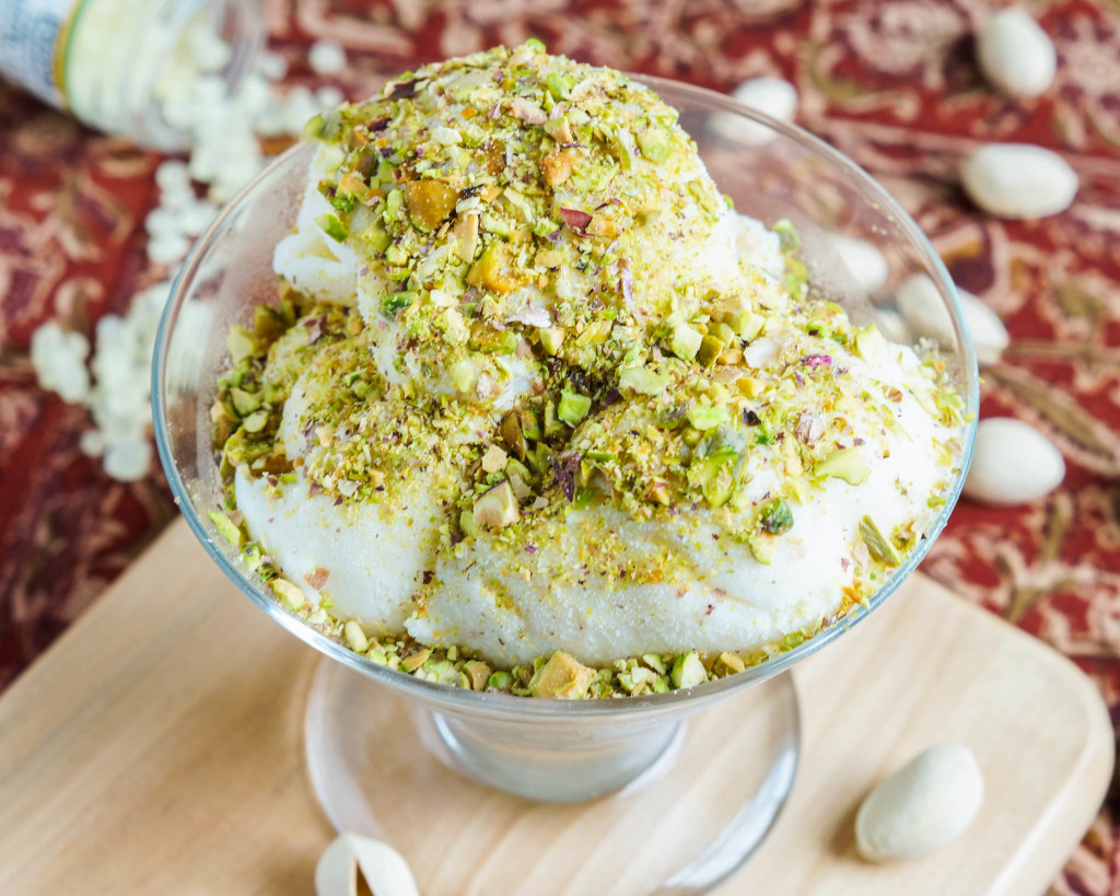 Éma’a (Syrian Ice Cream) in a glass bowl and covered in crushed pistachios. 