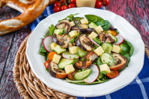 Brezensalat (German Pretzel Salad) in a white bowl.