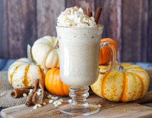 Pumpkin Spice White Hot Chocolate in a tall clear mug.