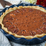 Brownie Pecan Pie in a blue pie dish.
