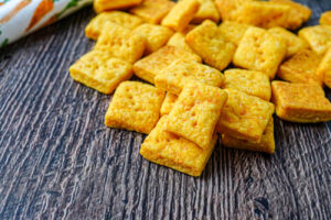 Carrot Cheese Crackers in a pile.