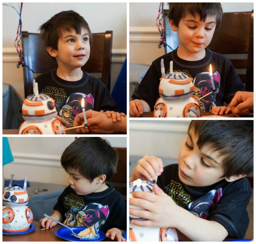 Blowing out candle on BB8 cake.