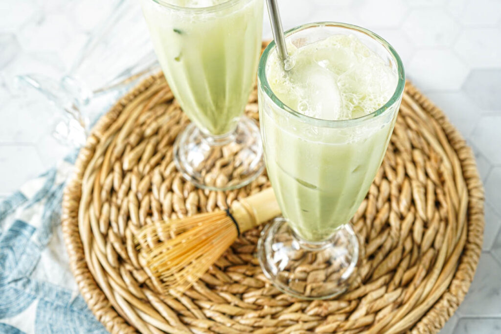 Matcha Egg Cream in two tall glasses.