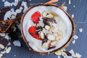 Coconut Smoothie Bowl in a halved coconut shell.