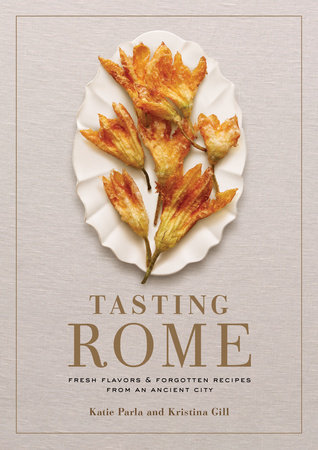 Tasting Rome cookbook cover with squash blossoms on a white oval plate. 