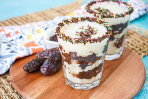 Brownie Batter Swirl Smoothie in two chocolate sprinkle-rimmed glasses.