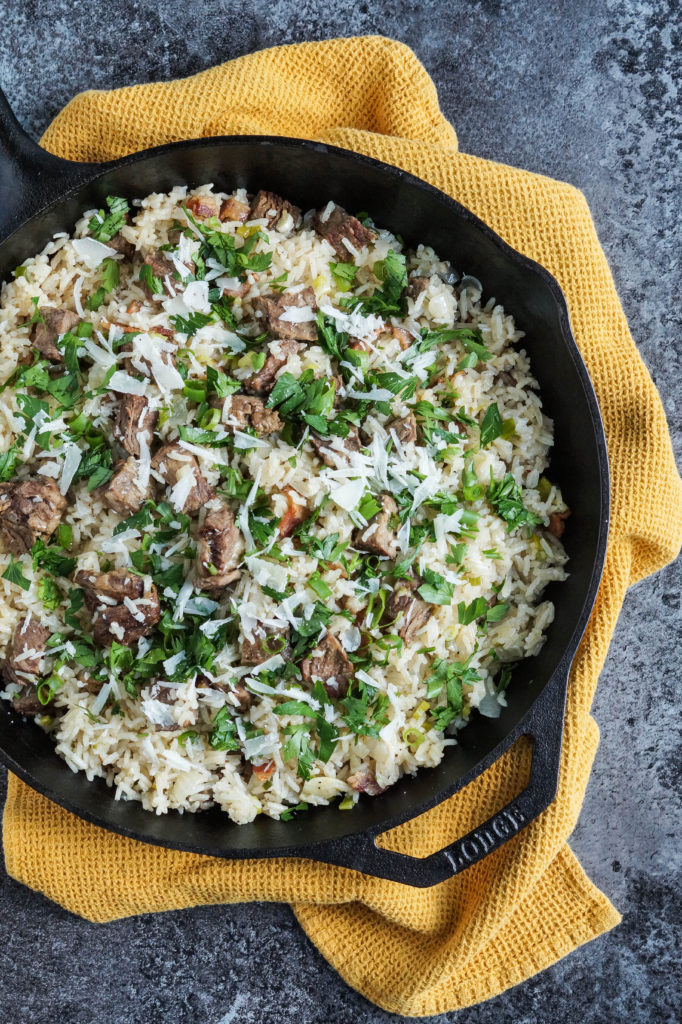 Arroz Carreteiro (Brazilian Wagoners' Rice) topped with parsley and parmesan.