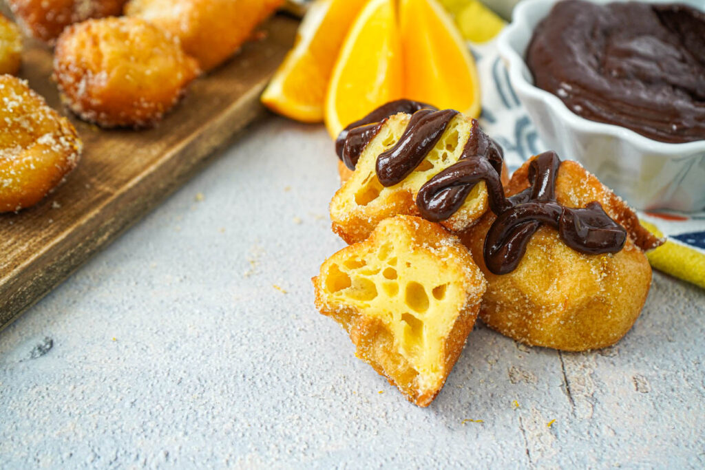 Buñuelos topped with a drizzle of Brown Velvet Glaze.