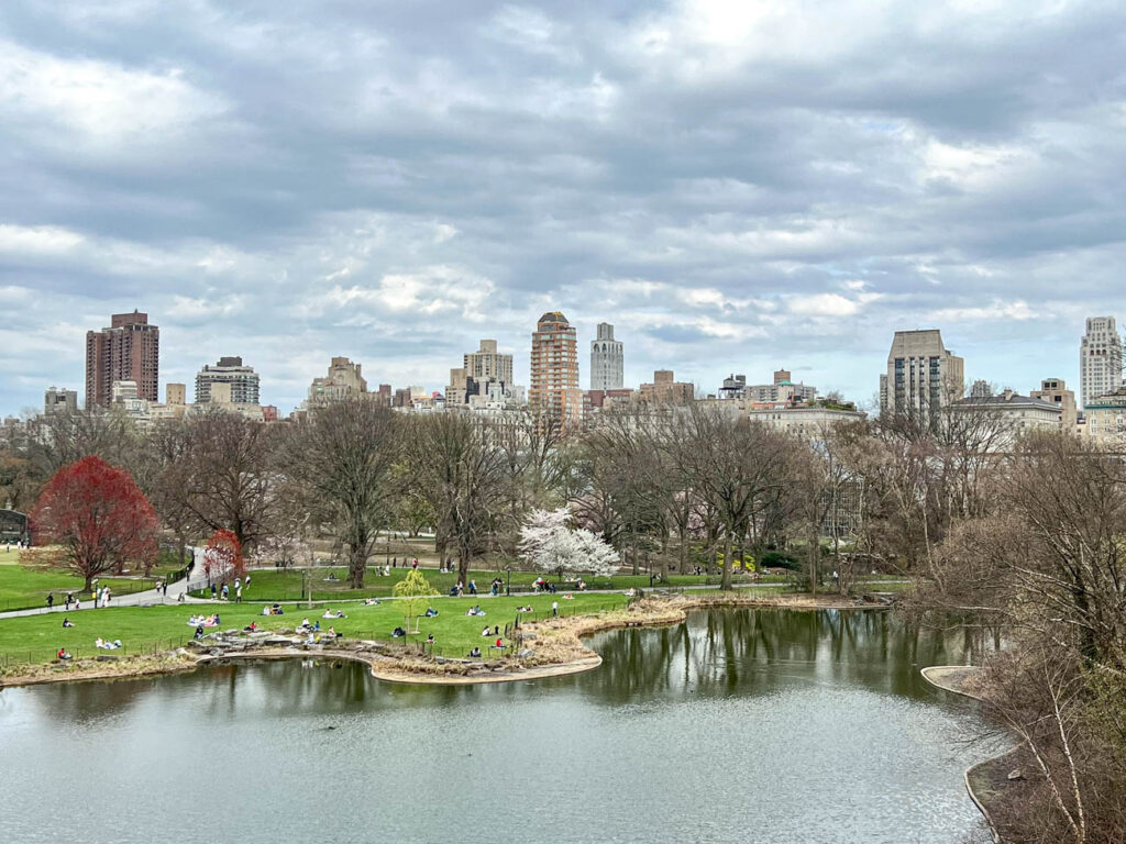 View of pond and skyline of Upper East Side from Central Park.