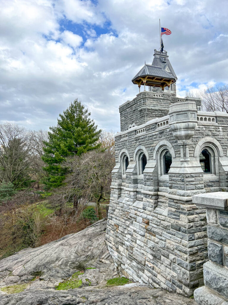 Side view of Belvedere Castle with American flag on top.