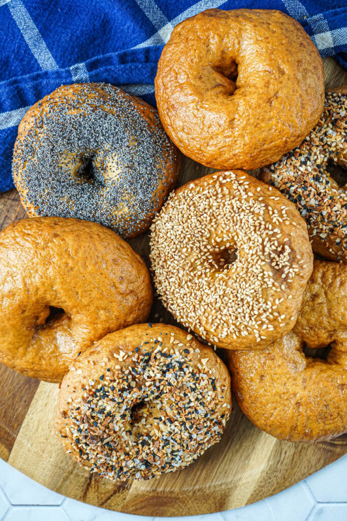 Aerial view of plain, everything, sesame seed, and poppy seed New York Style Bagels.