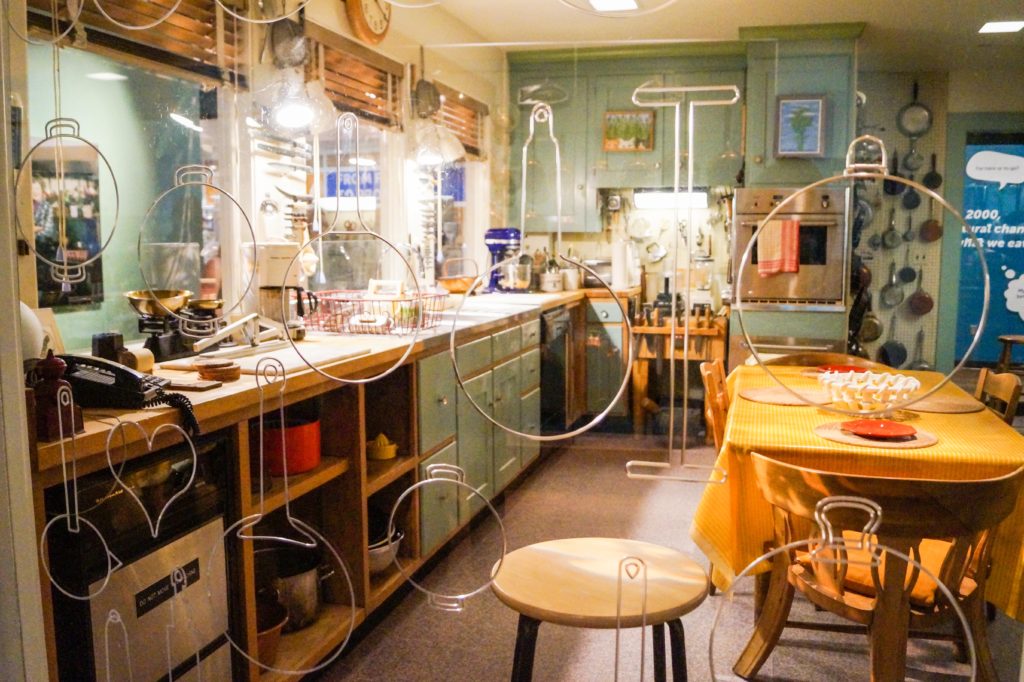 Julia Child's Cambridge, Massachusetts kitchen with dining table, cabinets, and oven built into the wall.