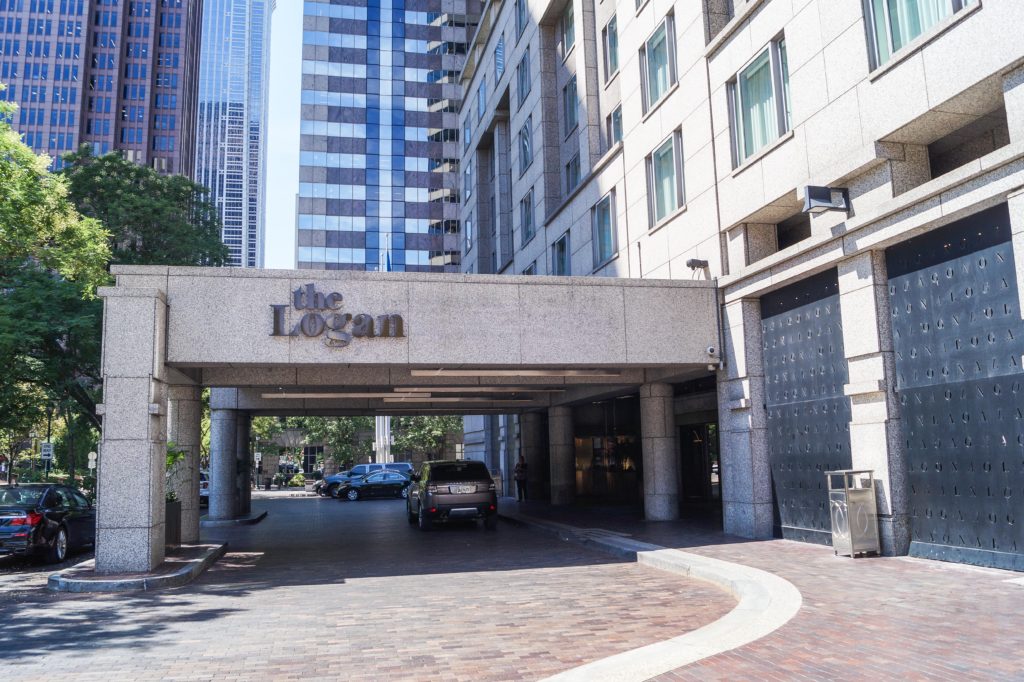 Car pulling into the entrance of The Logan Hotel.