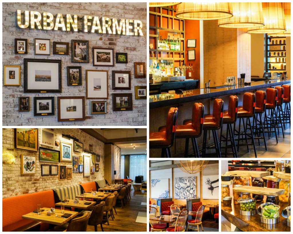 Urban Farmer restaurant at The Logan Hotel with red stools lined up at a bar, booths, and Urban Farmer sign.
