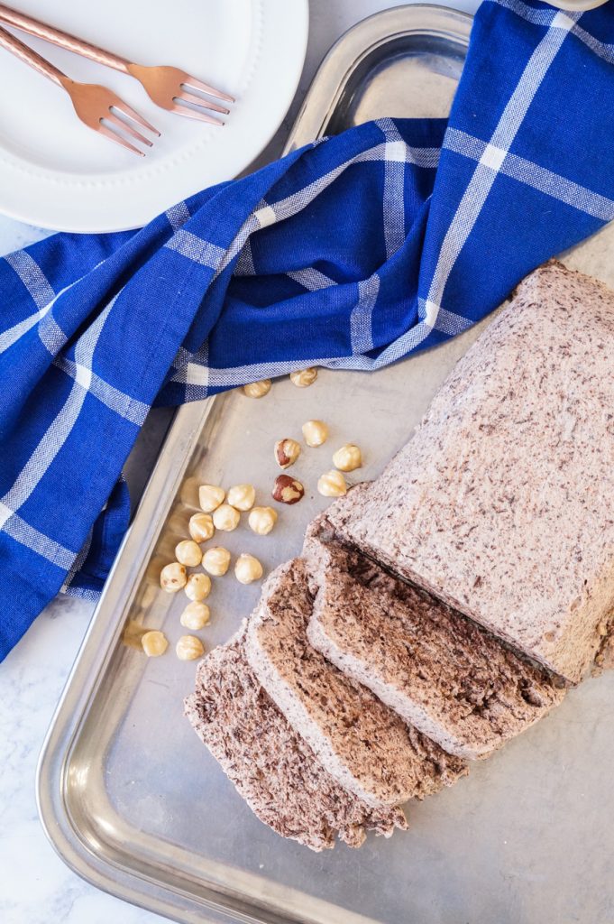 Aerial view of Chocolate Nutella Semifreddo next to a blue towel and white plate.