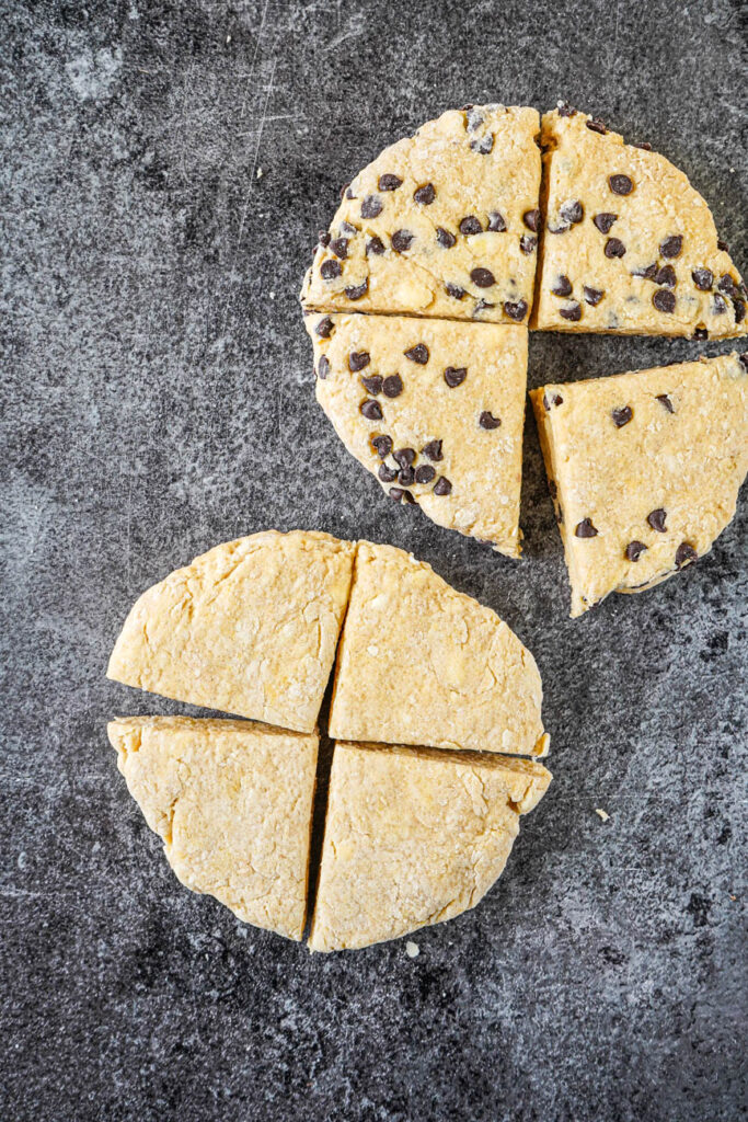 Two discs of Irish Cream Scones with one filled with mini chocolate chips.