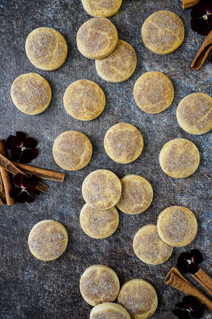 Aerial view of Biscotti Diamante next to red pansies and cinnamon sticks.