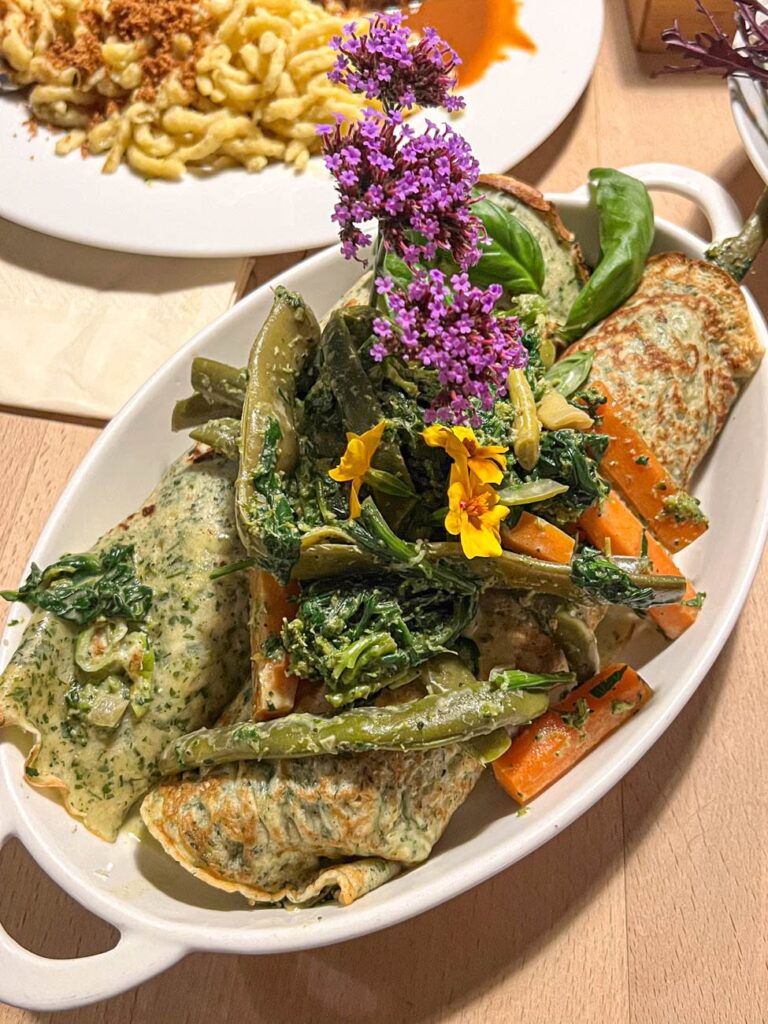 Kräuterflädle filled with tender vegetables.