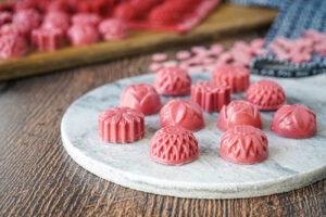 Ruby Chocolate Bonbons on a marble board.