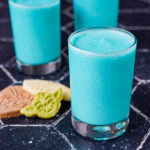 Galaxy's Edge Inspired Blue Milk in three glasses next to cookies.