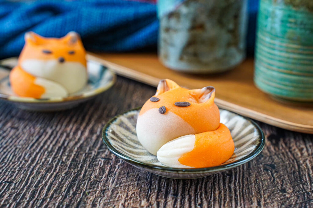 Two Fox Nerikiri on small plates.