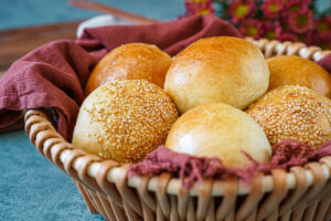 Panini Morbidi in a basket with a maroon towel.