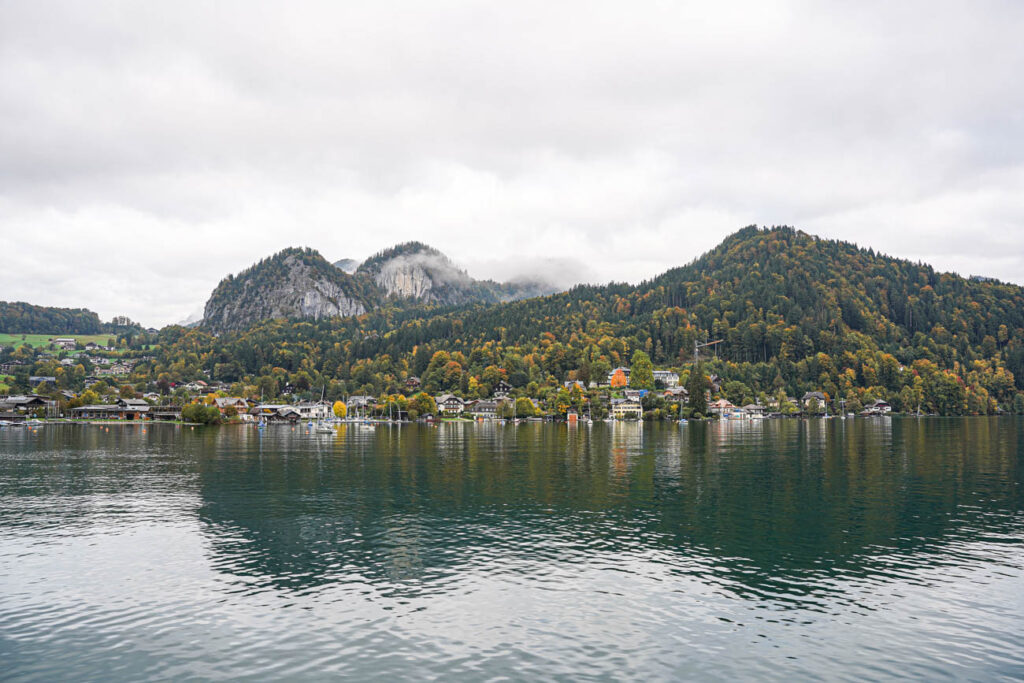 Waterfront view of St. Gilgen with mountains in the background.