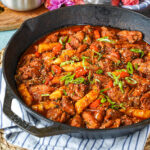 Dakgalbi (Spicy Stir-Fried Chicken) in a cast iron pan.