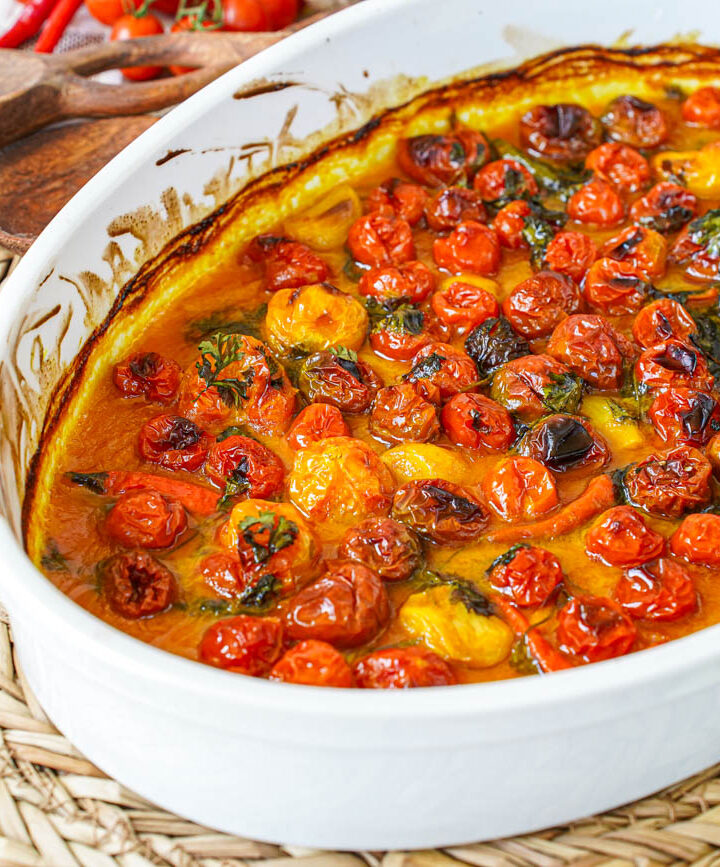 Coconut and Ginger Roasted Cherry Tomatoes in an oval baking dish.